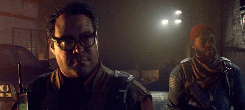 A Man In A Vest That Says ' Army ' On It Is Pointing GIF