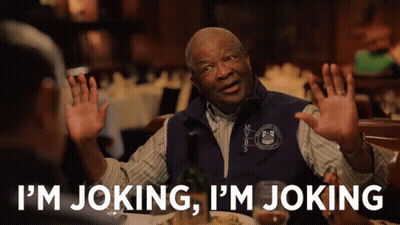 A Man In A Vest That Says Mvbs On It Says I 'M Joking GIF