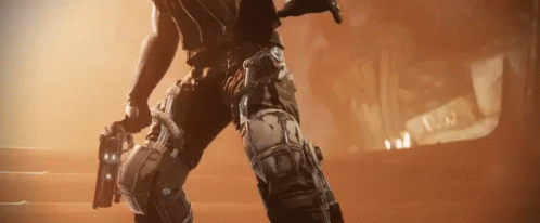 A Man In A Video Game Is Holding A Gun In His Hand . GIF