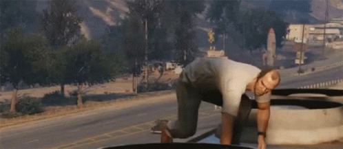 A Man In A Video Game Is Laying On The Ground GIF
