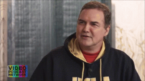 A Man In A Video Podcast Network Hoodie Is Talking To Someone GIF