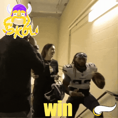 A Man In A Vikings Jersey Is Running Down Stairs With The Word Win Behind Him GIF