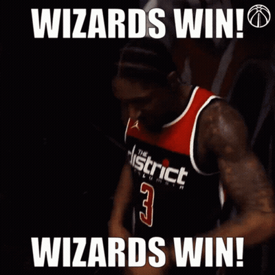 A Man In A Washington D.c. Wizards Jersey Is Celebrating GIF