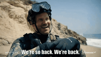 A Man In A Wet Suit Says We 'Re So Back GIF