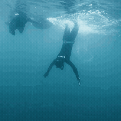 A Man In A Wet Suit With The Word Mares On The Back GIF
