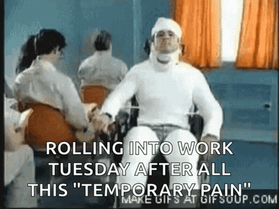 A Man In A Wheelchair Has A Bandage On His Head And Says Rolling Into Work Tuesday After All This Temporary Pain GIF