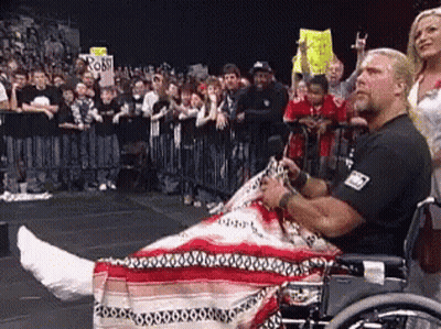 A Man In A Wheelchair Has A Cast On His Leg GIF