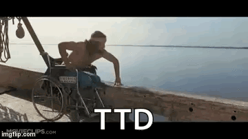 A Man In A Wheelchair Is Standing On A Dock Near The Water . GIF