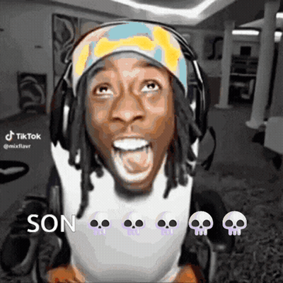 A Man In A Wheelchair Is Wearing Headphones And A Headband With Skulls On It And Says Son GIF
