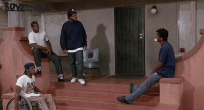 A Man In A Wheelchair Sits On The Steps Of A Boyz In The Hood House GIF