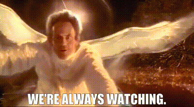 A Man In A White Angel Costume With The Words `` We 'Re Always Watching '' Written Below Him GIF