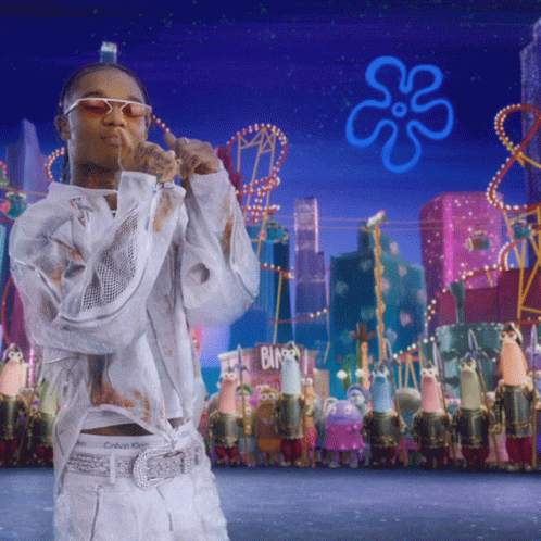A Man In A White Calvin Klein Shirt Stands In Front Of A Spongebob Scene GIF