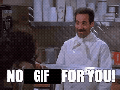 A Man In A White Chef 'S Coat Is Standing In A Kitchen Talking To A Woman . GIF