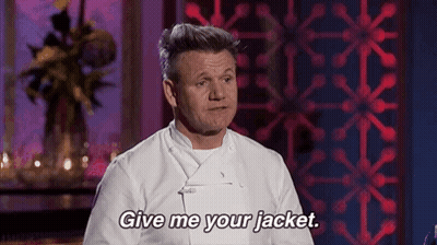 A Man In A White Chef 'S Jacket Is Standing In Front Of A Red Wall And Says `` Give Me Your Jacket '' . GIF