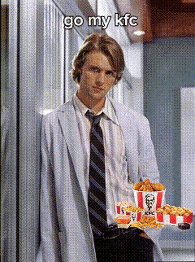 A Man In A White Coat And Tie Is Holding A Tray Of Kfc Fried Chicken GIF