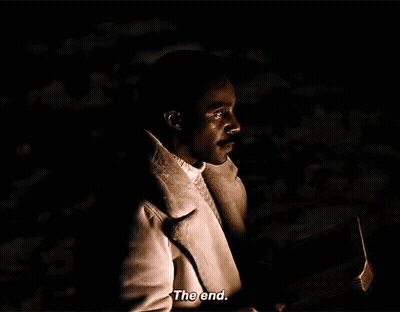A Man In A White Coat Is Holding A Book In His Hand And Says `` The End '' . GIF