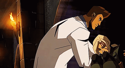 A Man In A White Coat Is Standing Next To A Woman GIF