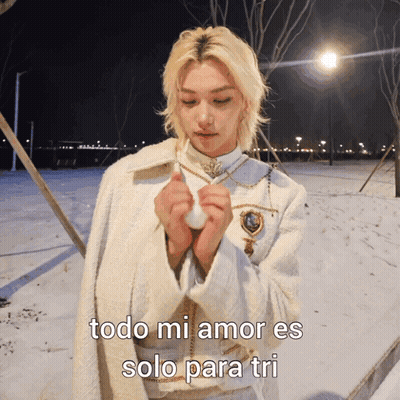 A Man In A White Coat Stands In The Snow With The Words Todo Mi Amor Es Solo Para Tri Written Below Him GIF