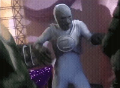 A Man In A White Costume With The Letter Z On His Chest Is Dancing GIF