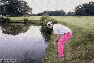 A Man In A White Hat And Pink Pants Is Playing Golf GIF
