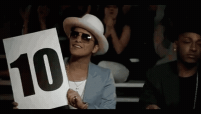 A Man In A White Hat Is Holding Up A Sign That Says 10 GIF
