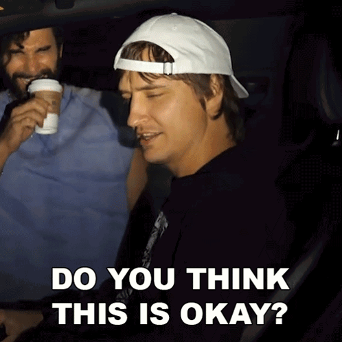 A Man In A White Hat Is Sitting In A Car With The Words Do You Think This Is Okay Below Him GIF