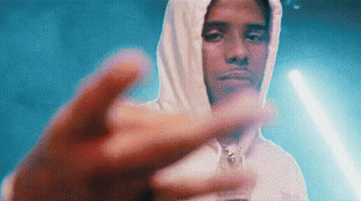 A Man In A White Hoodie Is Giving The Middle Finger . GIF