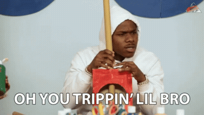 A Man In A White Hoodie Is Holding A Wooden Stick And The Words Oh You Trippin ' Lil Bro Are Above Him GIF