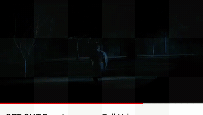 A Man In A White Hoodie Stands Next To Another Man In A Black Jacket GIF