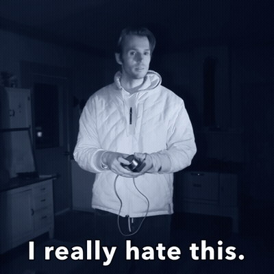 A Man In A White Jacket Is Holding A Video Game Controller And The Words I Really Hate This Are Below Him GIF