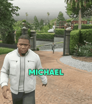 A Man In A White Jacket Is Walking Down A Path With The Name Michael Above Him GIF