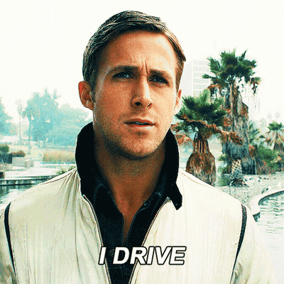 A Man In A White Jacket Says I Drive In Front Of Palm Trees GIF