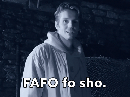 A Man In A White Jacket Stands In Front Of A Fence With The Words Fafo Fo Sho Written Below Him GIF