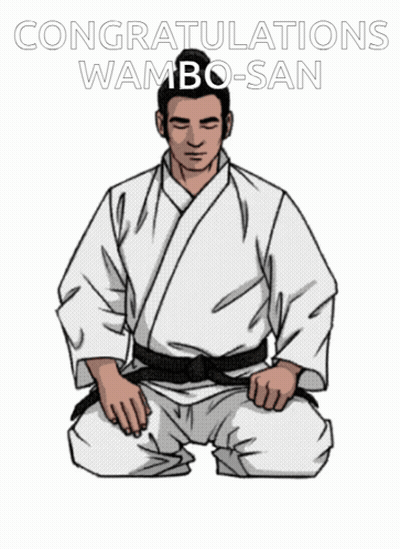A Man In A White Karate Uniform Is Kneeling Down With The Words Congratulations Wamba-San Written Above Him GIF