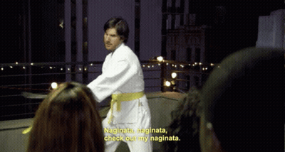 A Man In A White Karate Uniform With A Yellow Belt Says " Naginata Naginata Check Out My Naginata " GIF