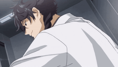 A Man In A White Lab Coat Is Looking Down GIF
