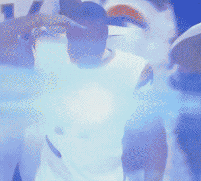 A Man In A White Nike Jersey Is Standing In A Crowd GIF