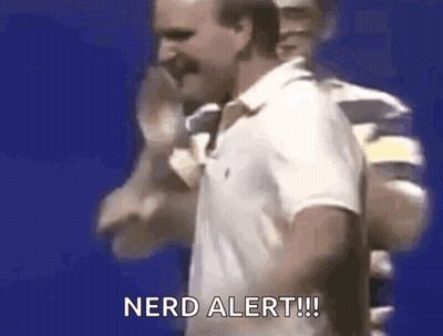 A Man In A White Polo Shirt Is Standing In Front Of A Blue Background . GIF
