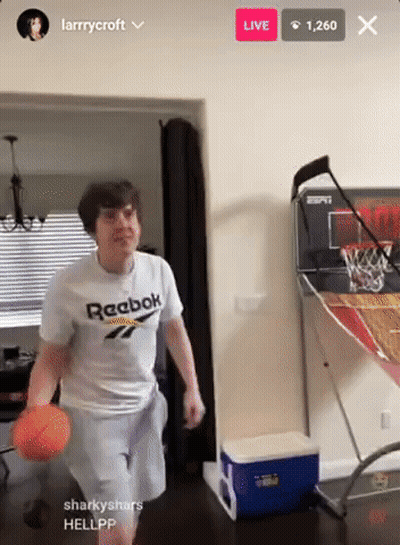 A Man In A White Reebok Shirt Is Playing Basketball GIF