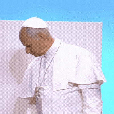 A Man In A White Robe Holds A Piece Of Paper In His Hands GIF