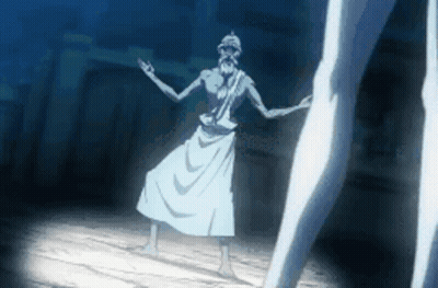 A Man In A White Robe Is Dancing In A Dark Room With A Woman Standing Behind Him . GIF