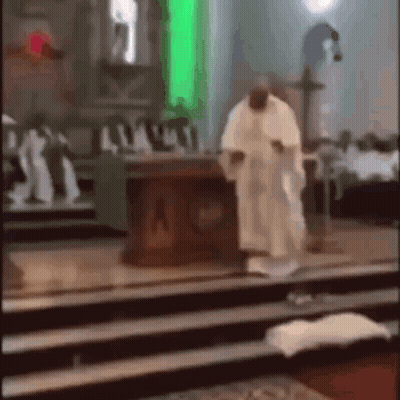 A Man In A White Robe Is Standing In Front Of A Church Altar . GIF