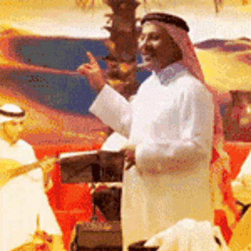 A Man In A White Robe Is Standing In Front Of A Podium And Giving A Speech GIF