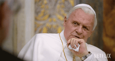 A Man In A White Robe With The Word Netflix On The Bottom Right GIF