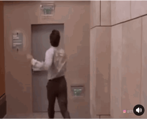 Man Dancing In Front Of Exit Sign GIF