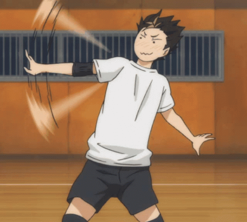 A Man In A White Shirt And Black Shorts Throws A Volleyball GIF