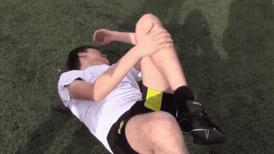 A Man In A White Shirt And Black Shorts With The Word Asics On The Side GIF