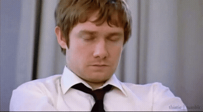 A Man In A White Shirt And Black Tie Is Sleeping With His Eyes Closed . GIF