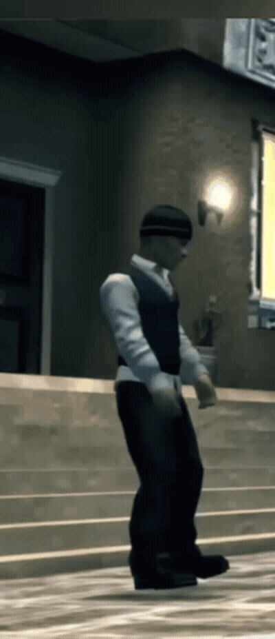 A Man In A White Shirt And Black Vest Is Standing On A Set Of Stairs GIF