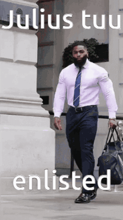 A Man In A White Shirt And Blue Tie Is Walking Down A Sidewalk Carrying A Duffel Bag .. GIF